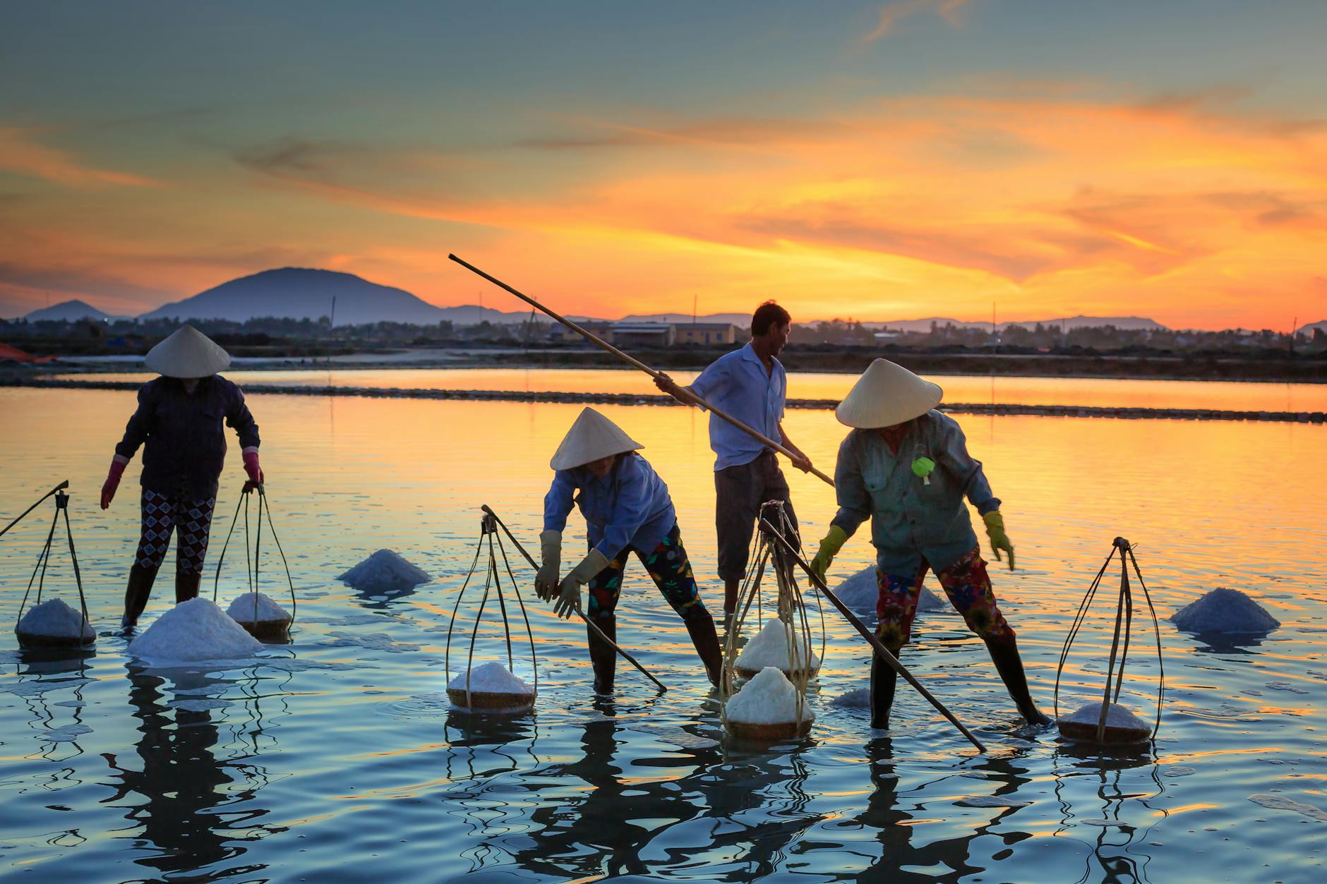 landscape of men harvesting salt