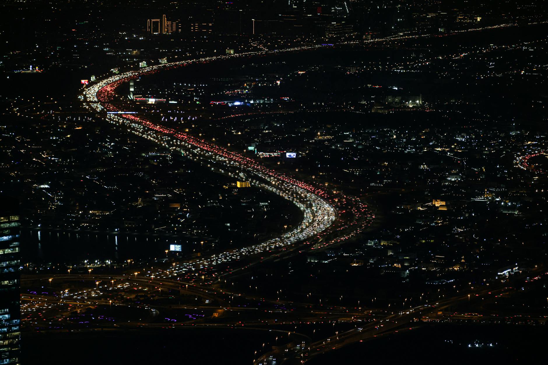 vibrant nighttime aerial cityscape with traffic
